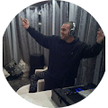 Image of man in black hoodie dancing wearing headphones