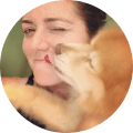 Image of woman licked by dog